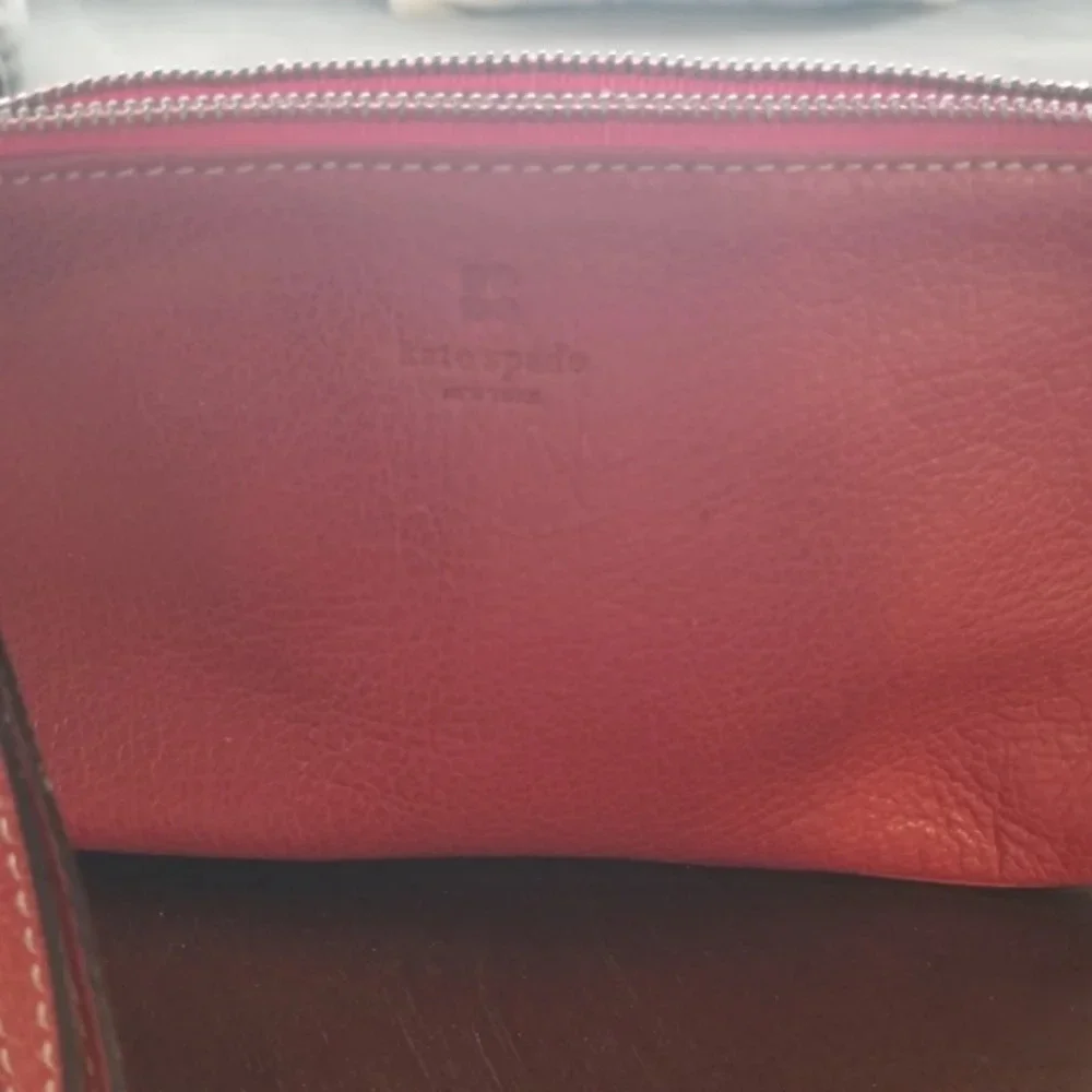 Kate Spade red pebbled leather wristlet bag